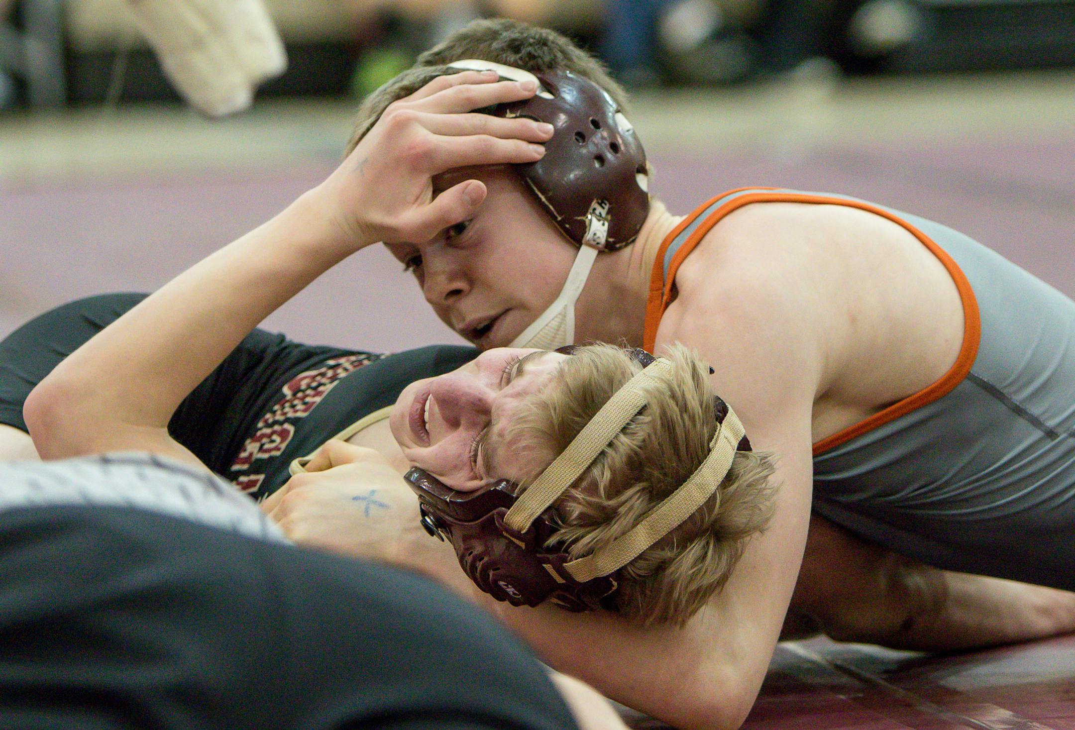 Farmington senior Victor Gliva (top) is the state's top-ranked wrestler at 113 pounds.