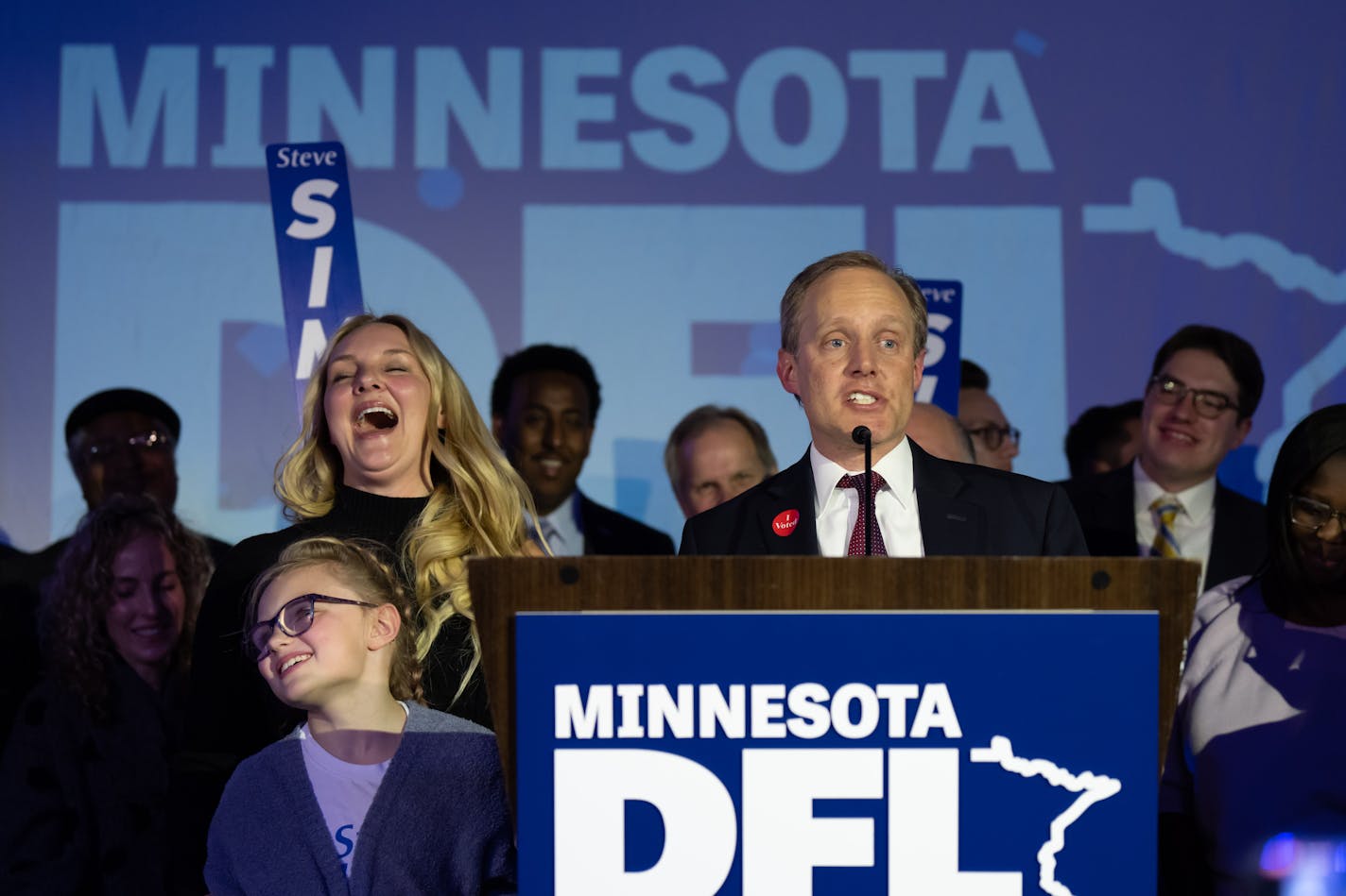 Secretary of State Steve Simon took the stage with his family, left, after winning the election Wednesday, Nov. 9, 2022 St. Paul, Minn. DFL election night victory party at the Intercontinental Hotel. ] GLEN STUBBE • glen.stubbe@startribune.com