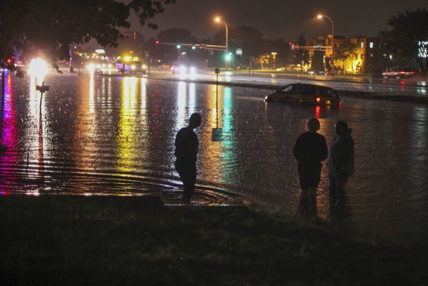 Flash flooding caught a motorist unaware near the intersection of University and 73rd Aves. NE in Fridley.