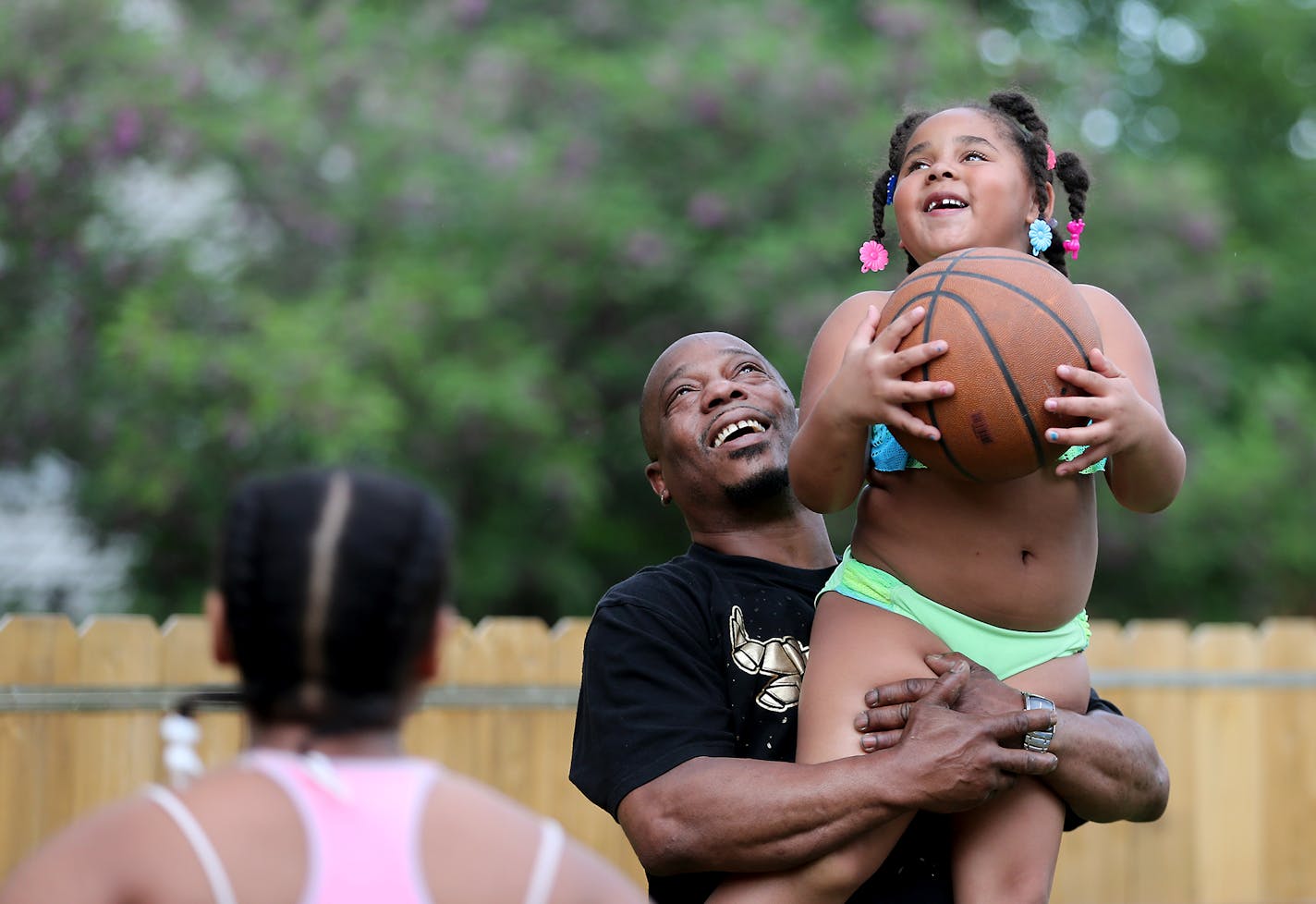 Dorsey Howard Jr. played basketball with his grandkids including his granddaughters Jazzminn Williams, 5, cq, right, and Jaleiya Williams, 11, cq, in his backyard, Friday, June 14, 2019 in Golden Valley, MN. ] ELIZABETH FLORES &#x2022; liz.flores@startribune.com