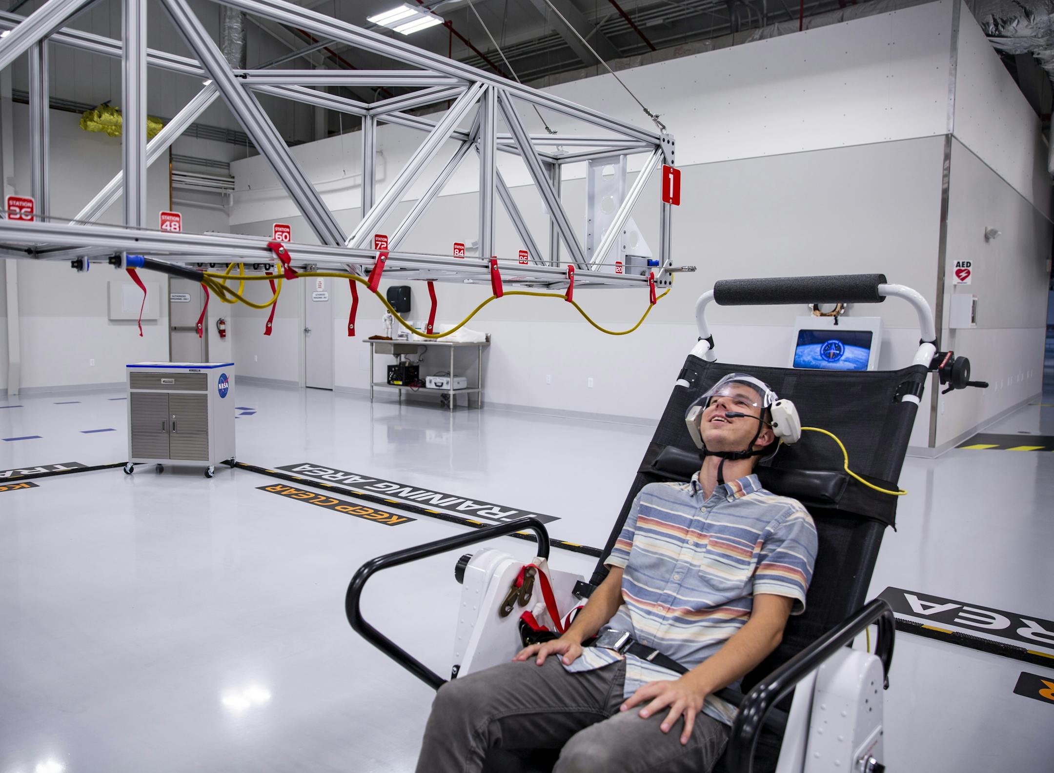 Reporter Patrick Connolly tries out the microgravity simulator in the Astronaut Training Experience at Kennedy Space Center on March 13, 2019. (Patrick Connolly/Orlando Sentinel/TNS)