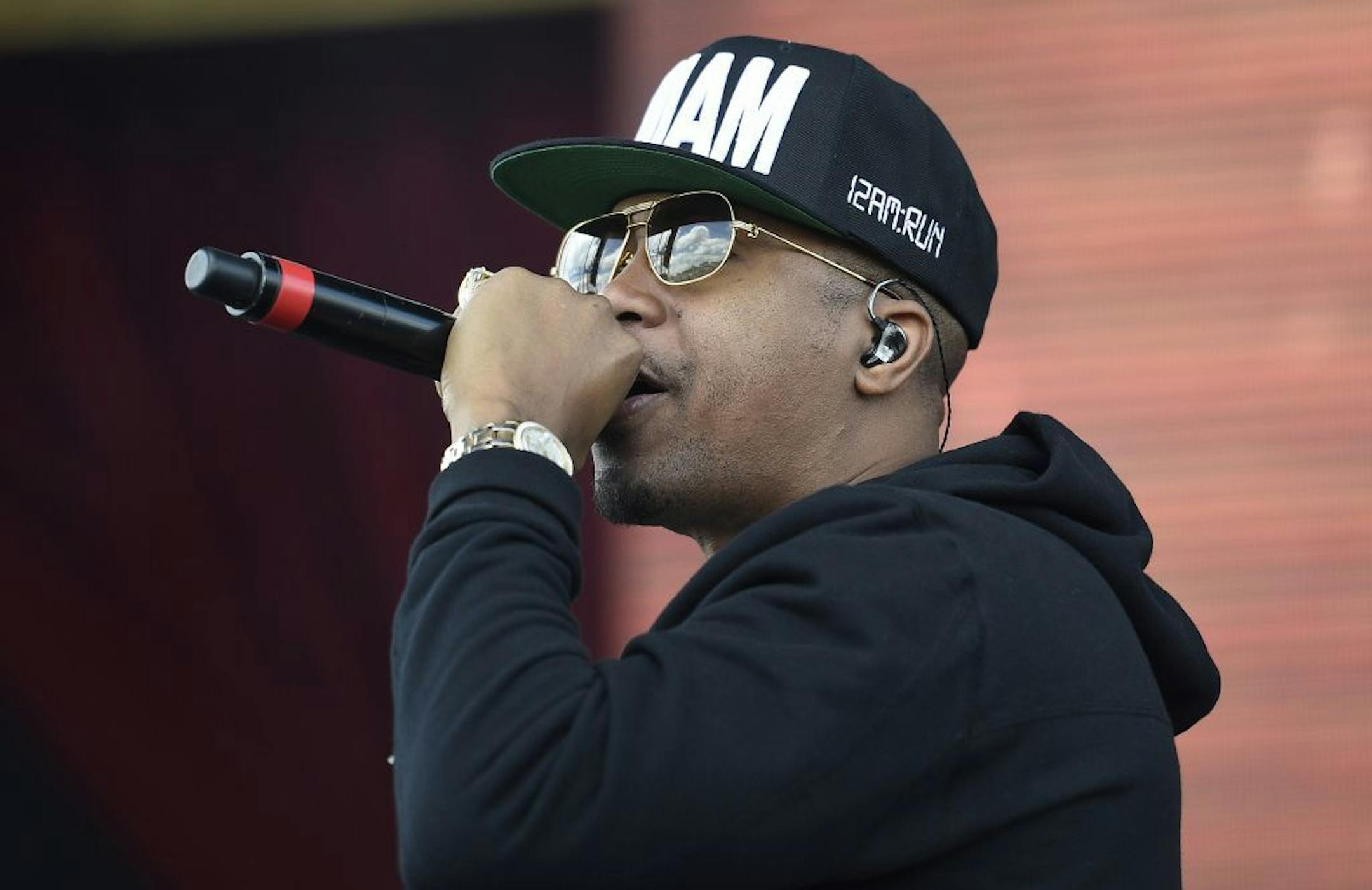 Entertainer Nas performs in the infield before the 139th Preakness Stakes horse race at Pimlico Race Course, Saturday, May 17, 2014, in Baltimore.