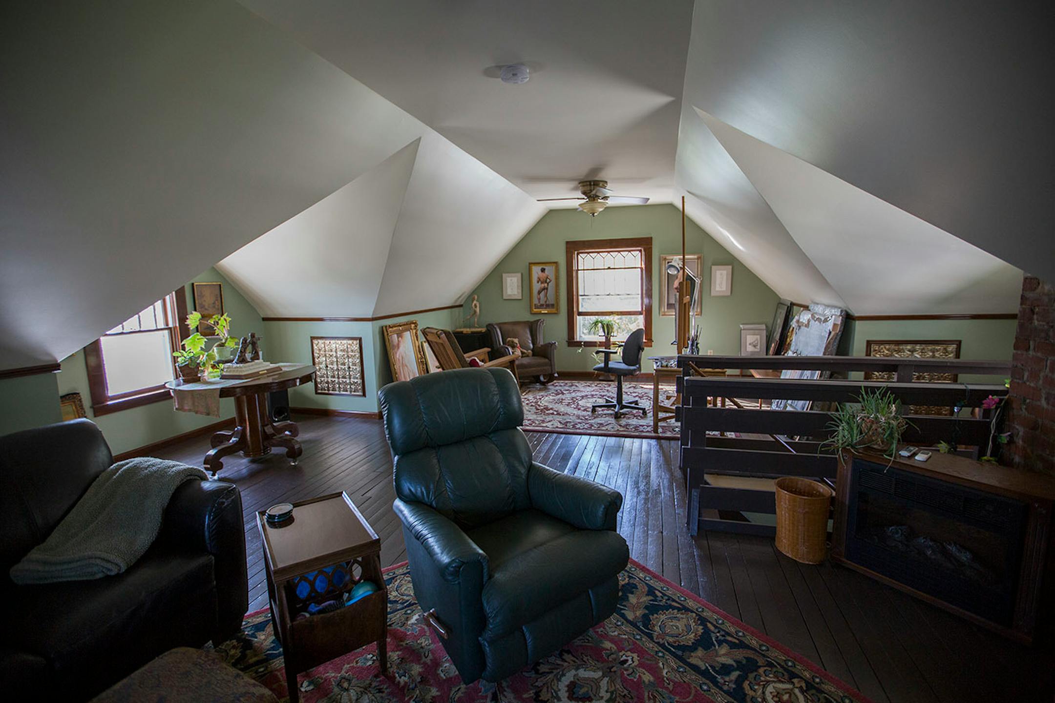The 470-square-foot attic was transformed into an artists' studio on one side and a TV room on the other.