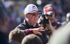 Jerry Kill talks to the team after the annual spring game.