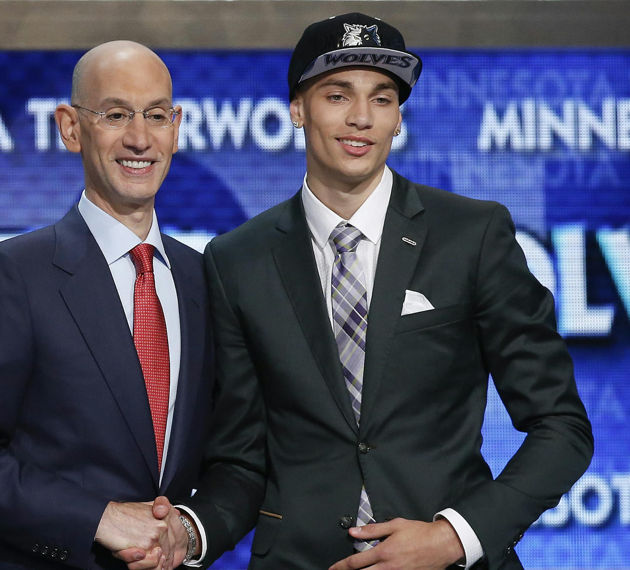 UCLA's Zach LaVine, right, poses for a photo with NBA commissioner Adam Silver after being selected 13th overall by the Minnesota Timberwolves during the 2014 NBA draft, Thursday, June 26, 2014, in New York. (AP Photo/Kathy Willens)