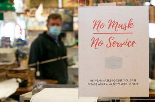 Father Time Antiques in Duluth, MN has posted signs requiring masks outside and inside their store. ALEX KORMANN • alex.kormann@startribune.com
