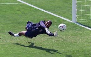 U.S. goalkeeper and Minnesota native Briana Scurry blocks a penalty shootout kick by China's Ying Liu during in the 1999 World Cup final at the Rose B