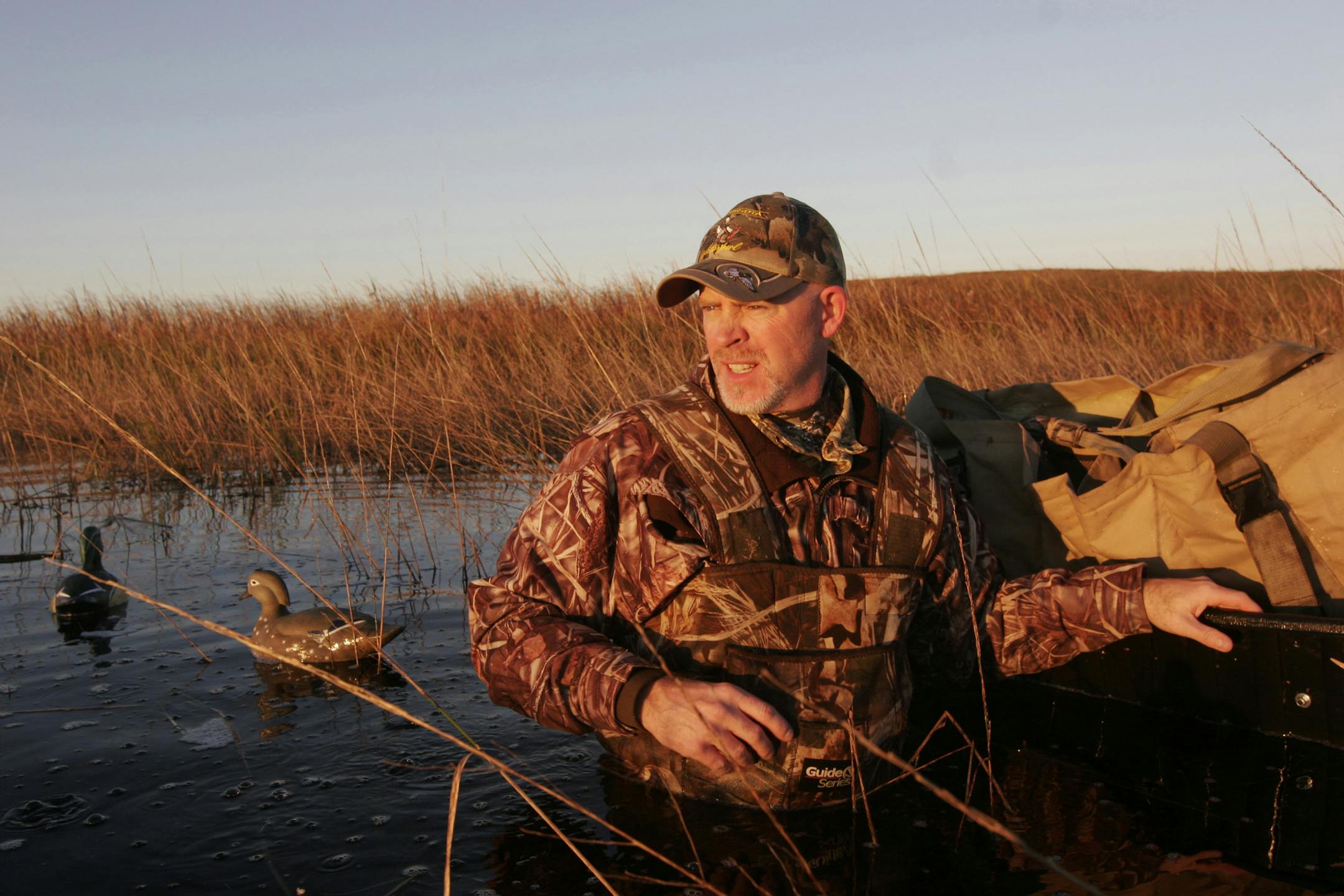 Doug Smith/Star Tribune; Oct. 2, 2010, near Sauk Centre, Minn. Brad Nylin, executive director of the Minnesota Waterfowl Association. puts out decoys in a slough Saturday morning near Sauk Center. It was the duck season opener. ORG XMIT: MIN2014092310531234