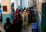 People queue to cast their votes at a polling station in Cape Town, South Africa, Wednesday, May 29, 2024.