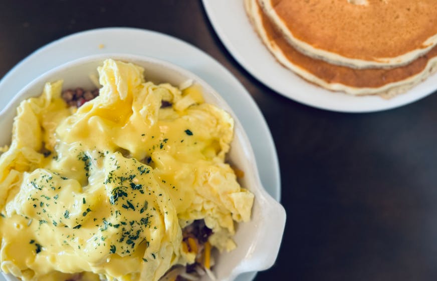 The skillet breakfast with a side of pancakes at Joseph's restaurant in Stillwater comes with a creamy, buttery hollandaise sauce on top.