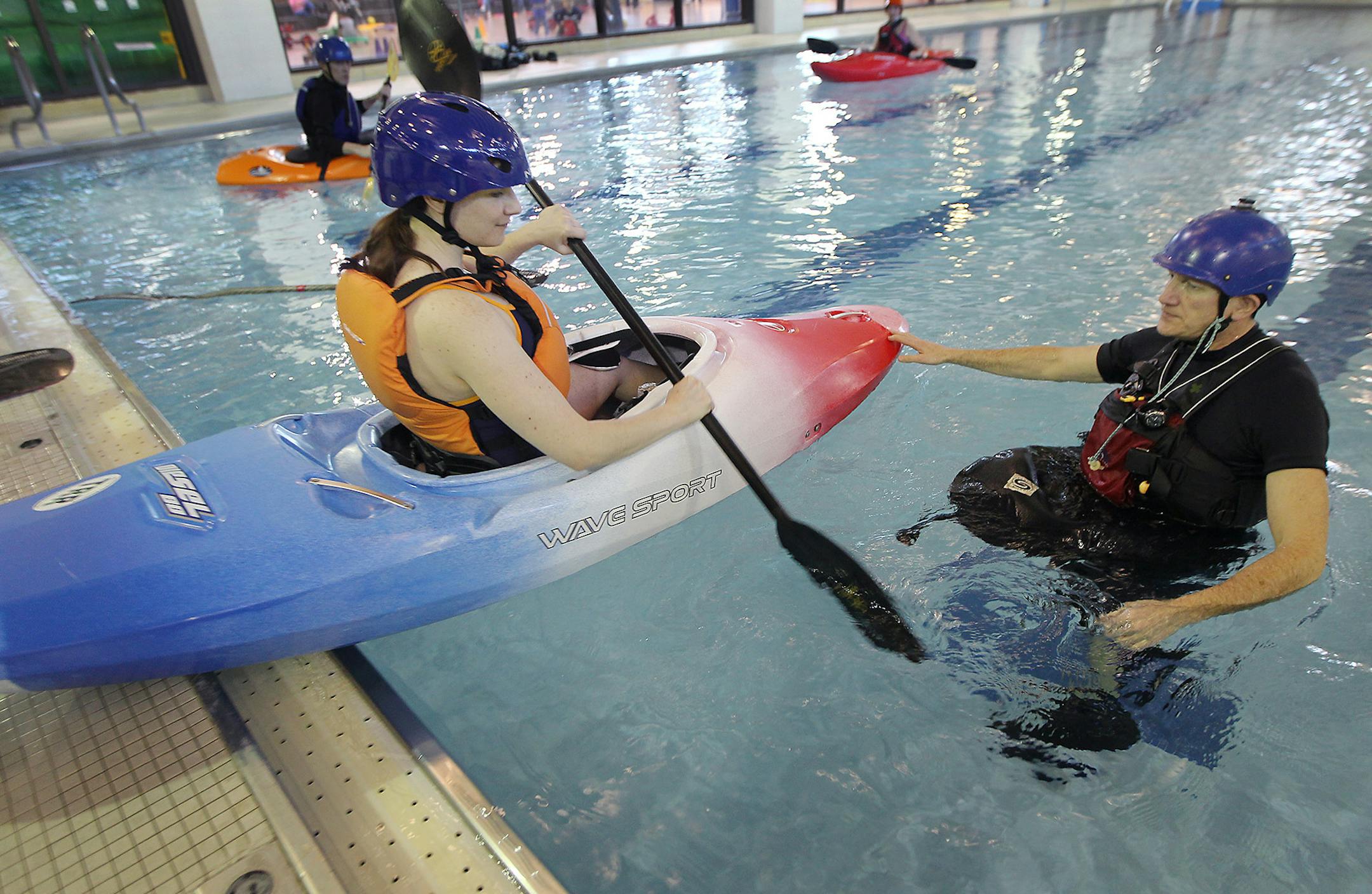 Patricia Fields, a military veteran, was guided into the Edinborough Park pool with the help of instructor Bill Kabitz, of Team River Runner, Friday, March 14, 2016 in Edina, MN. ] (ELIZABETH FLORES/STAR TRIBUNE) ELIZABETH FLORES • eflores@startribune.com
