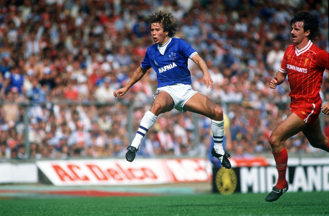 August 18, 1984: Everton's Adrian Heath in mid air as Liverpool's Mark Lawrenson races in.