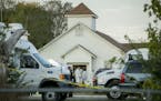 Investigators work at the scene of a mass shooting at the First Baptist Church in Sutherland Springs, Texas on Sunday, Nov. 5, 2017. (Jay Janner/Austi