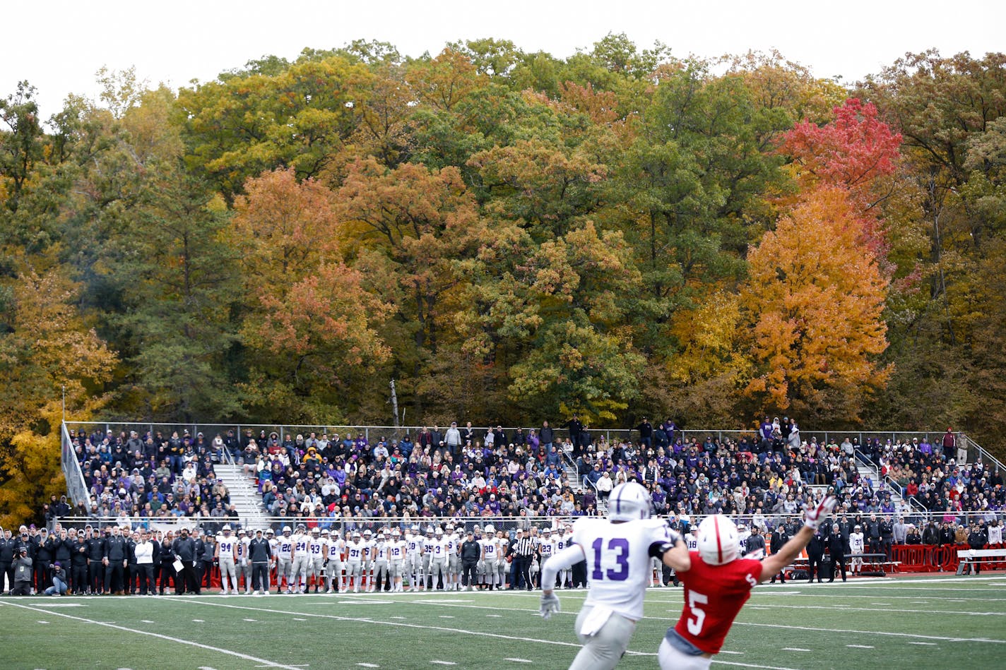 Fall colors were still hanging on during the a MIAC football battle of the Johnnies and Tommies in 2018. Football games, along with other fall sports, are likely to move to the spring for 2020-21