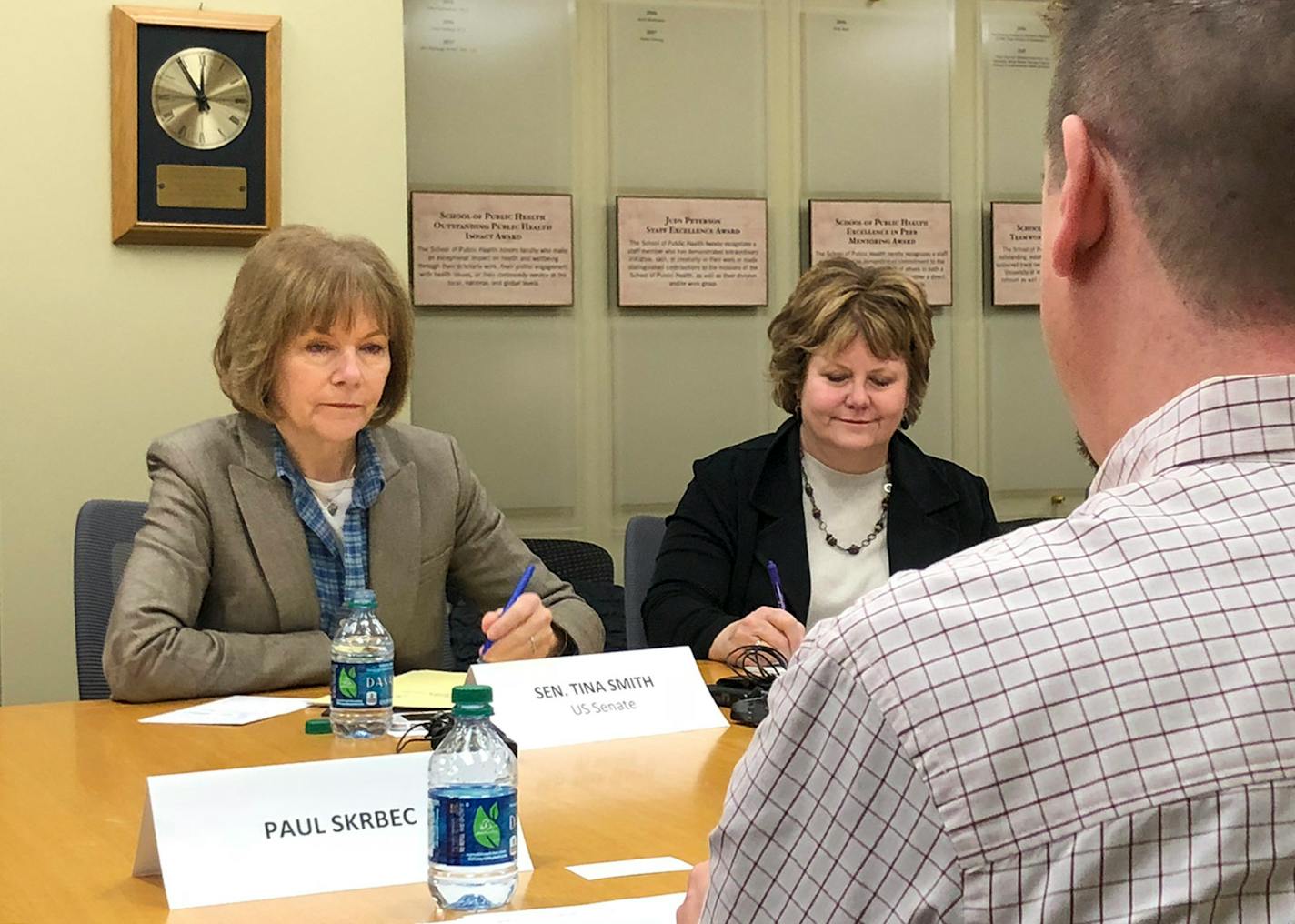 Sen. Tina Smith, D-Minn., listened to Paul Skrbec, 47, of Minneapolis, and others talk about the high price of prescription medications.