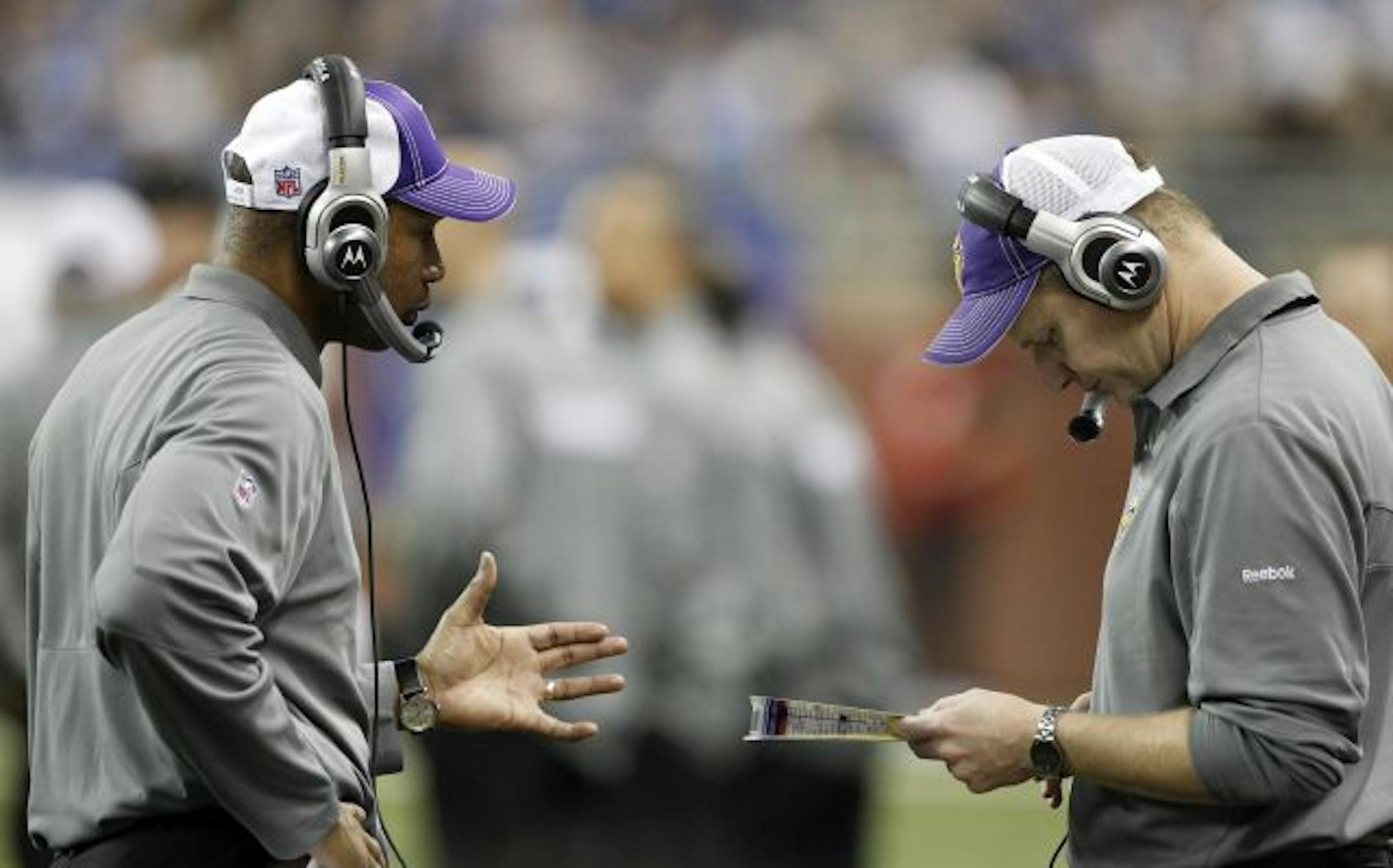 Vikings coach Leslie Frazier, left, and offensive coordinator Darrell Bevell worked on solutions for a nonproductive offense against the Lions.