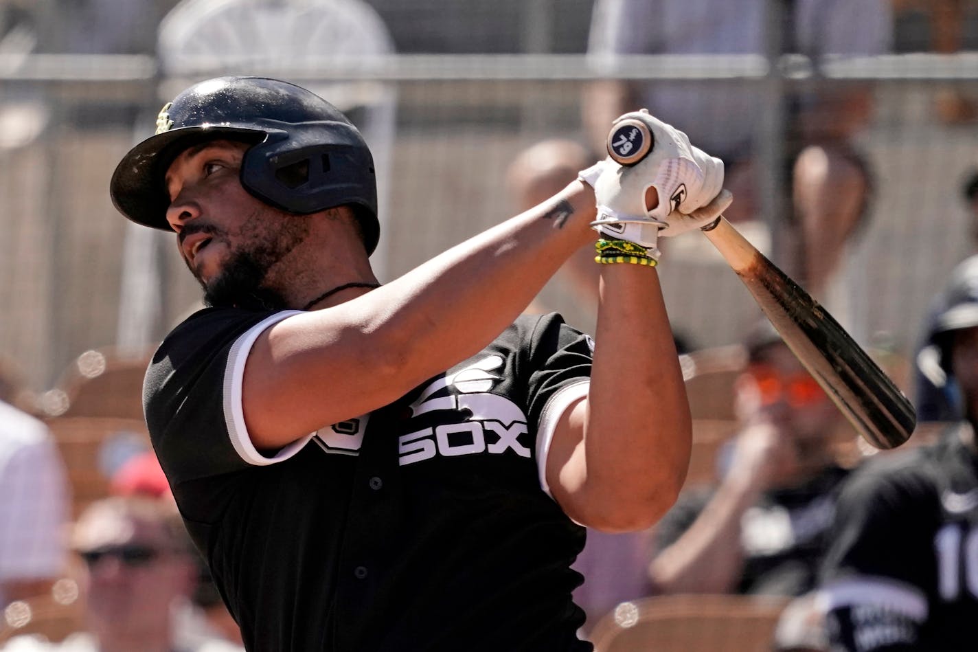 Chicago White Sox's Jose Abreu bats during the third inning of a spring training baseball game against the Oakland Athletics Friday, April 1, 2022, in Glendale, Ariz. (AP Photo/Charlie Riedel)