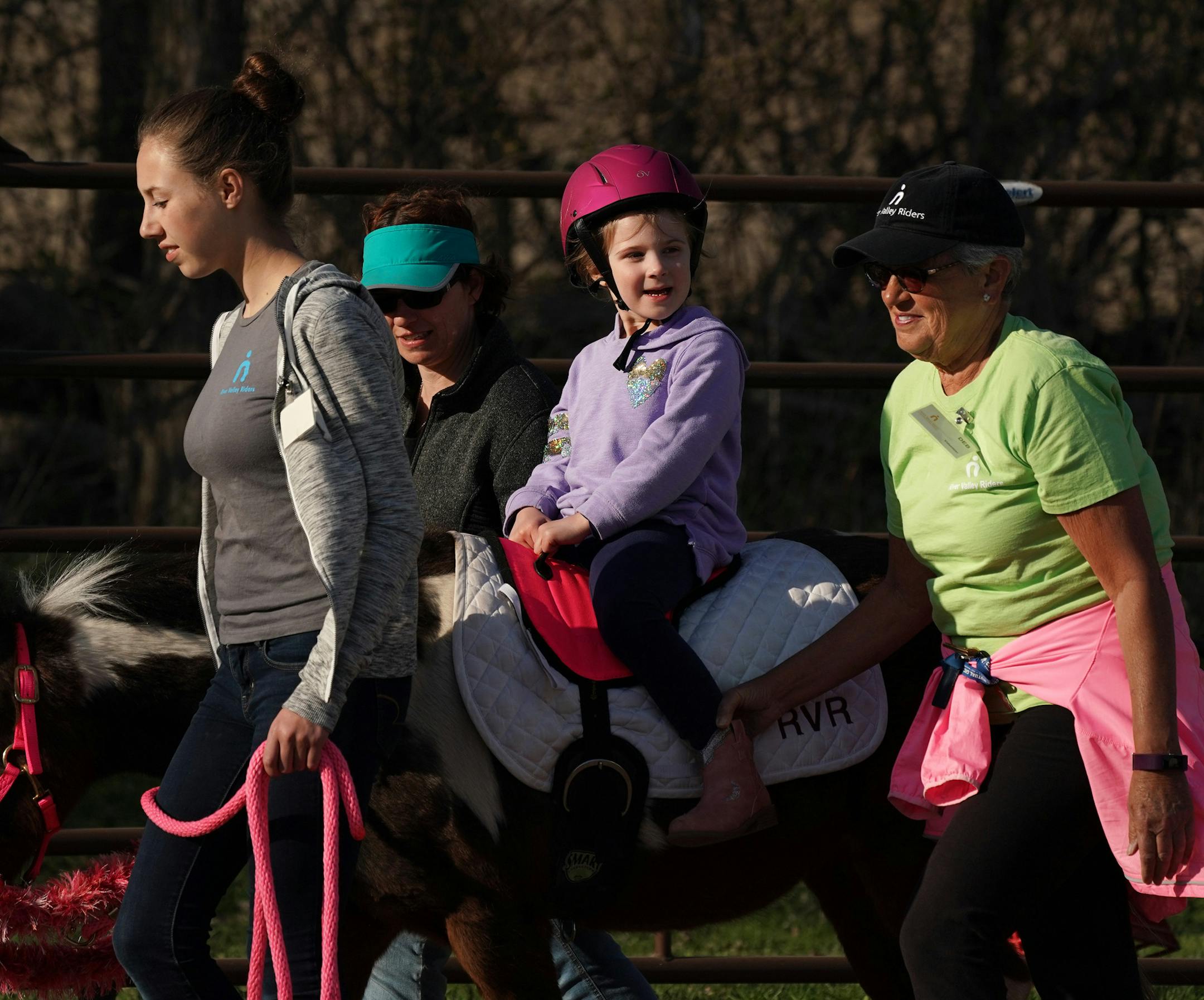 Maren Haugen, 4, smiled as she rode atop Daisy led by Grace Pearson during an Emerging Independent class Thursday at the River Valley Riders' facility in Afton. ] ANTHONY SOUFFLE &#x2022; anthony.souffle@startribune.com Students participated in equine programs Thursday, April 25, 2019 at the River Valley Riders equine therapy center in Afton, Minn. After nearly 20 years of hauling donated horses to fairgrounds or private barns for lessons the River Valley Riders have begun building their own fac