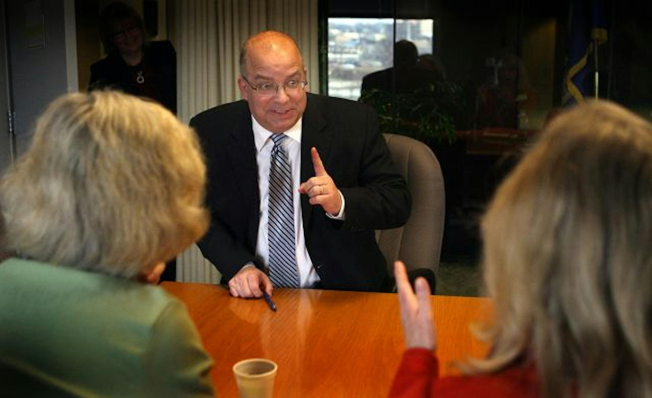 Tom Hanson, Minnesota's commissioner of the Office of Management and Budget, talked with Patti Cullen (left), president and CEO of Care Providers of Minnesota, and Gayle M. Kvenvold, president and CEO of Aging Services of Minnesota, during a meeting about Federal stimulus monies and the state budget. The meeting took place at the Minnesota Management and Budget offices in St. Paul.