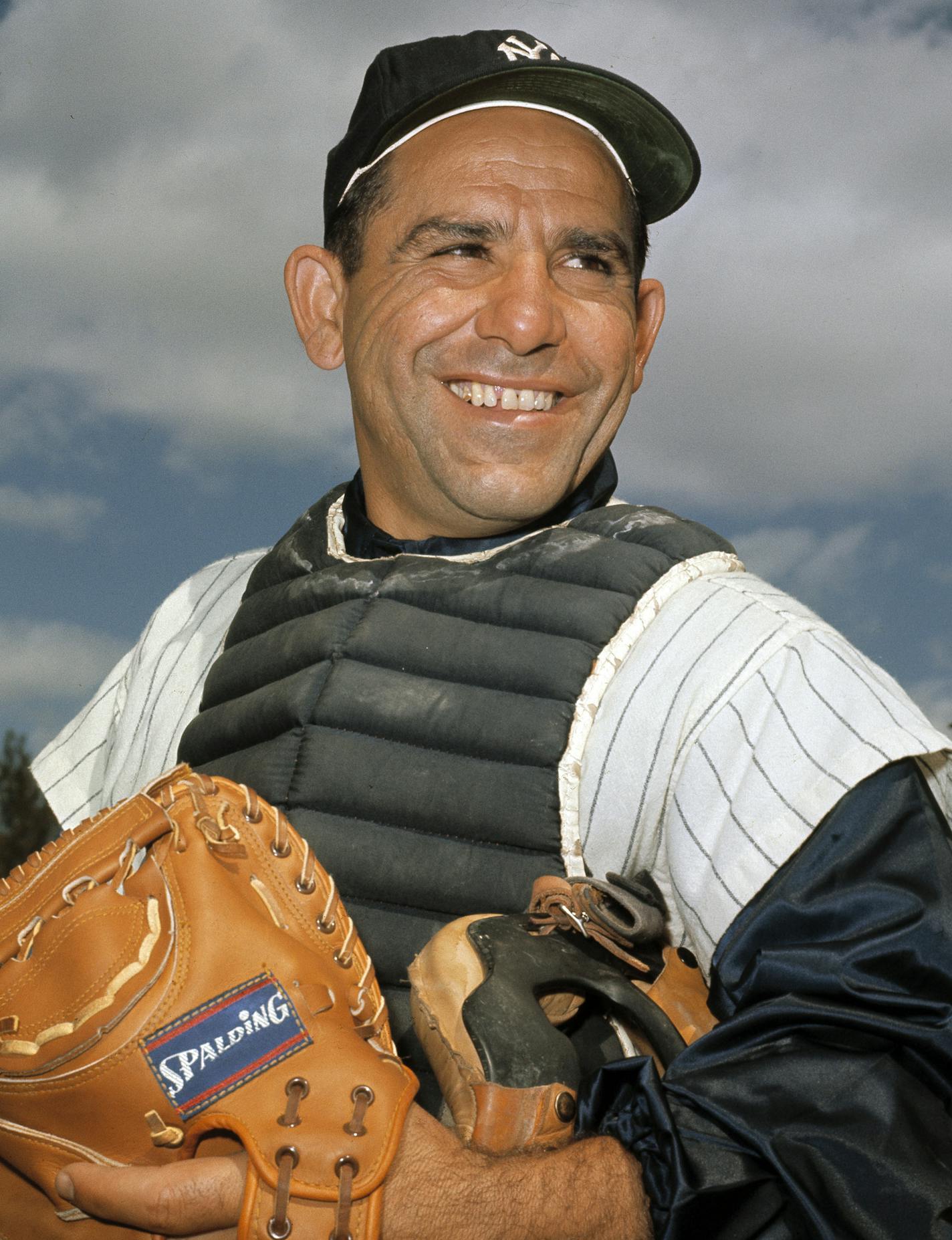 FILE - In this undated file photo, New York Yankee catcher Yogi Berra poses at spring training in Florida. The Hall of Fame catcher renowned as much for his lovable, linguistically dizzying "Yogi-isms" as his unmatched 10 World Series championships with the New York Yankees, died Tuesday, Sept. 22, 2015. He was 90. . (AP Photo/File)