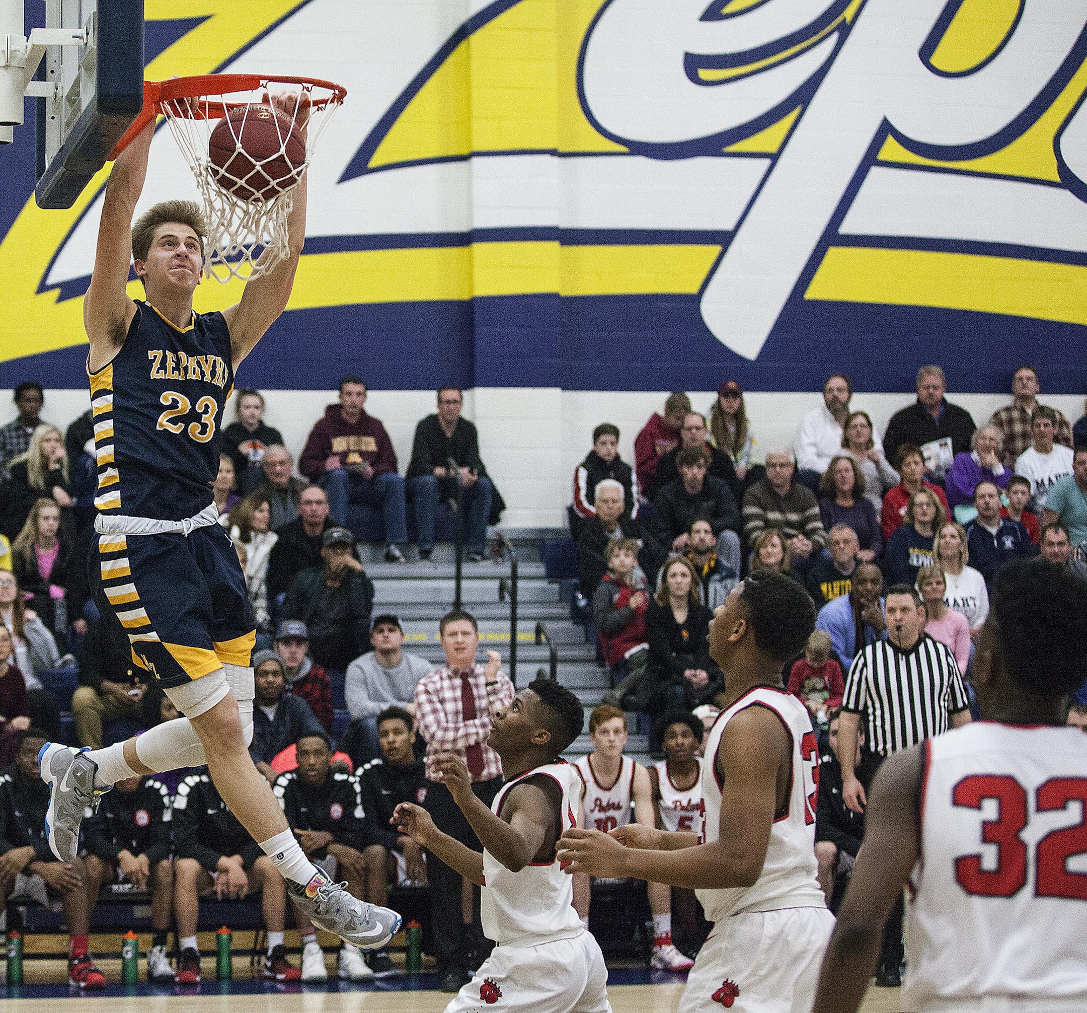 Mahtomedi Zephyrs forward Parker Fox (23) dunks the ball. ] XAVIER WANG &#x2022; xavier.wang@startribune.com Game action from an boy&#x2019;s basketball game between the Mahtomedi Zephyrs and North St. Paul Polars Friday. Feb, 03. 2017 at Mahtomedi High School in Mahtomedi, Minnesota.