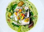 Mild-flavored halibut at Meritage in St. Paul is the right foil for a bounty of vegetables.