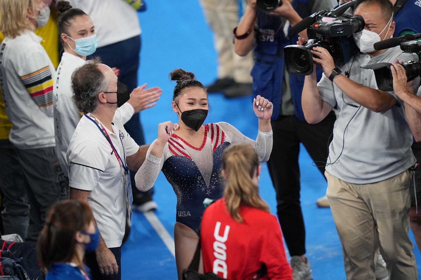 Sunisa Lee of the United States celebrates her gold medal in the women's all-around gymnastics competition at the postponed 2020 Tokyo Olympics in Tokyo on Thursday, July 29, 2021. (Doug Mills/The New York Times)