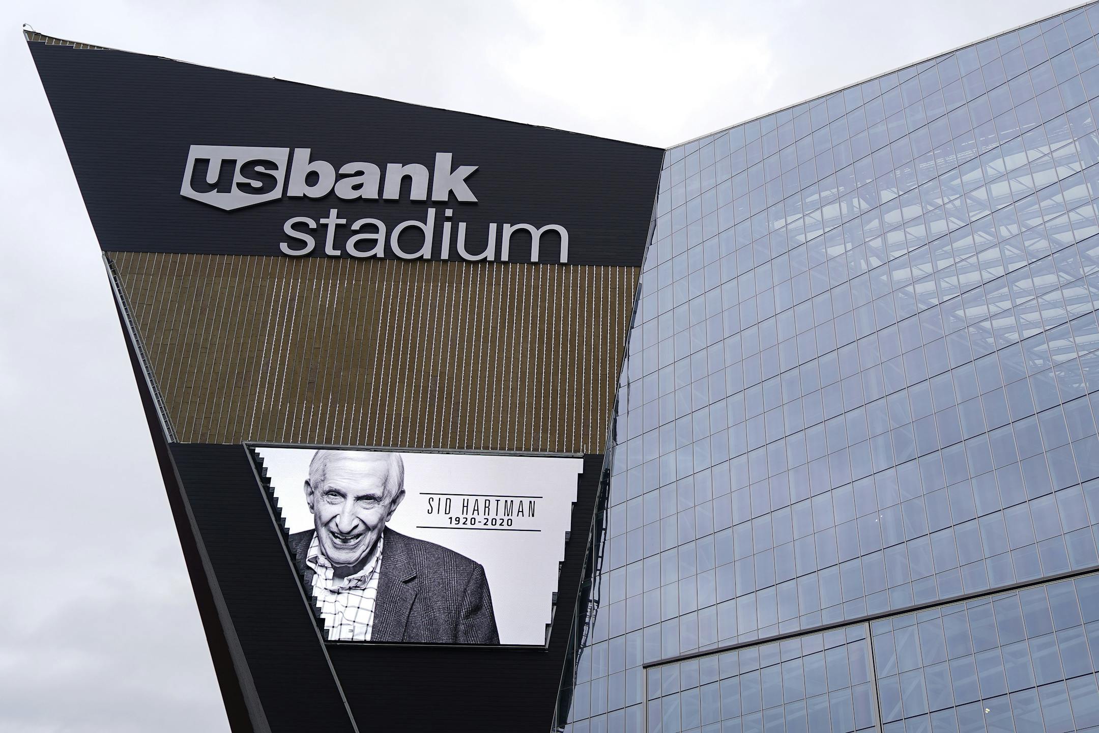 An image of longtime Star Tribune sports columnist Sid Hartman was projected on the video screen outside U.S. Bank Stadium noting his death Sunday