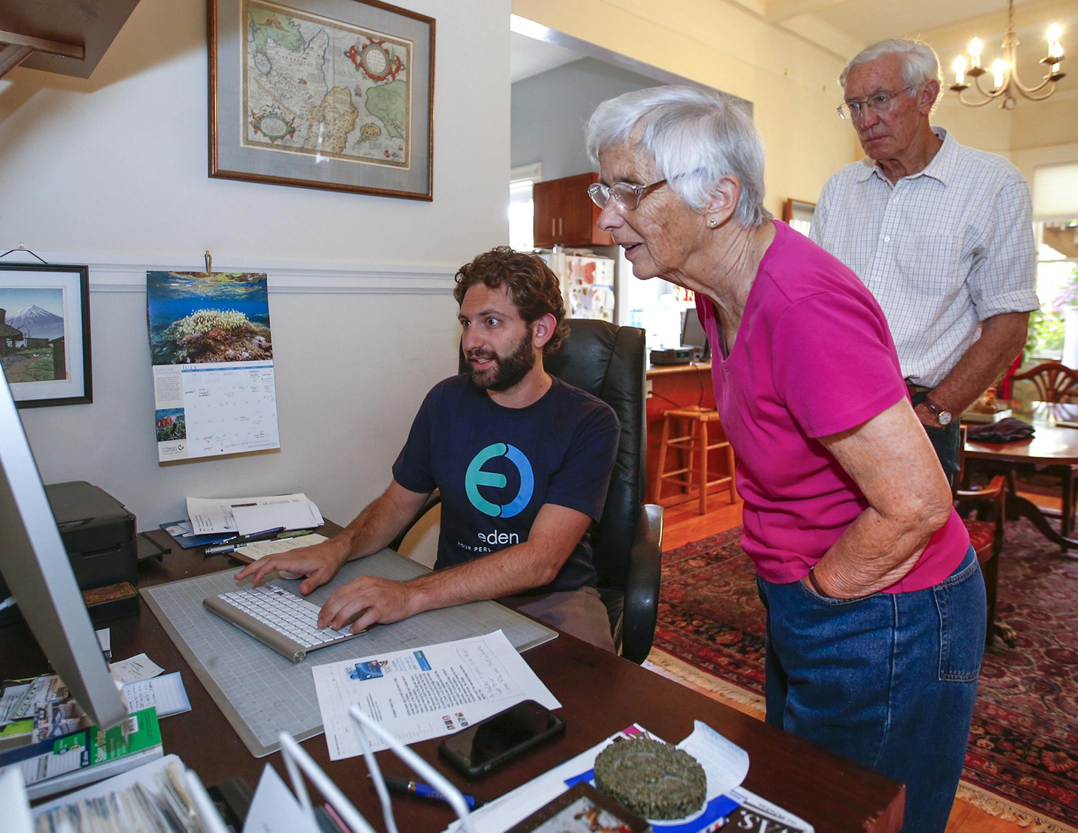 Eden repair technician Ronen Sberlo, left, helps Bill Bastik, 80, and his wife Sarah Bastik, 78, with a problem on their home computer on July 16, 2015 in San Francisco, Calif. Eden is a new on-demand tech repair service that makes house calls. (John Green/Bay Area News Group) ORG XMIT: 1171121