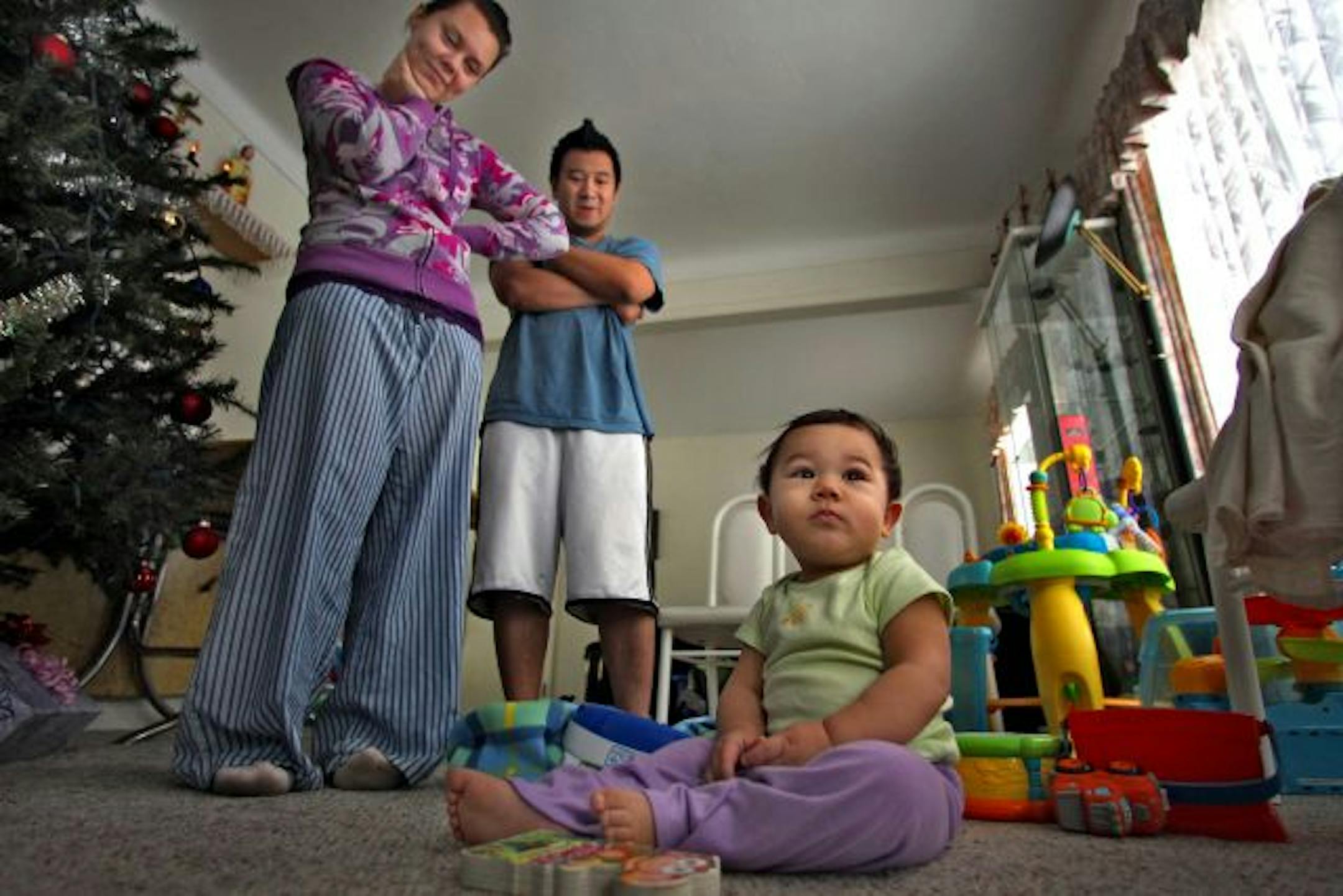 Crystal Schramm and Duy Hoang watched their son, Ayden, play in the living room of their St. Paul home Thursday morning. "I'm going to be taking him with me everywhere," his dad said.