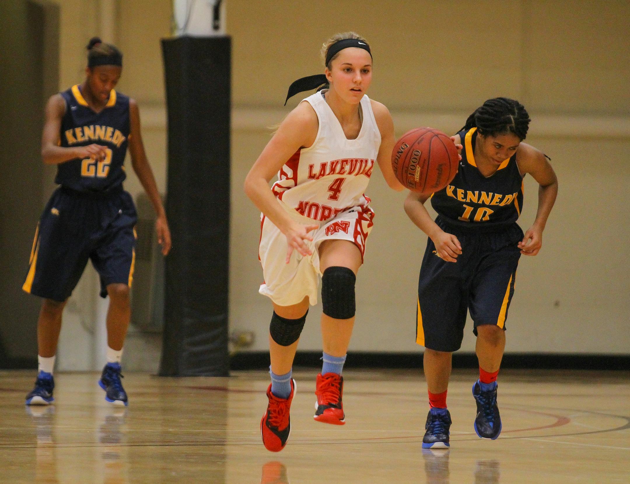 Lakeville North guard Temi Carda pushes the ball up the floor during a first-round game against Bloomington Kennedy in the Pat Paterson Thanksgiving Tournament on Nov. 28, 2014, at Hamline University. North won the game 49-20 and Carda was one of five Panthers players with six points. Photo by Mark Hvidsten