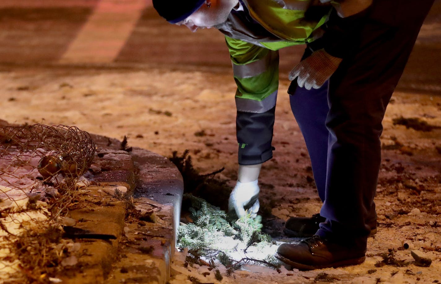 A Metro Transit employee, who wished to not be identified, cleaned up crash debris at the corner of 35th St. E. and Nicollet Ave. following an early morning car theft and crash Tuesday, March 14, 2017, in Minneapolis, MN. Two of three suspects in the crash fled the scene and have not yet been apprehended by police.] DAVID JOLES &#x2022; david.joles@startribune.com Car thieves stole a vehicle during the early morning hours Tuesday, hitting a metro transit bus before eventually crashing the vehicl