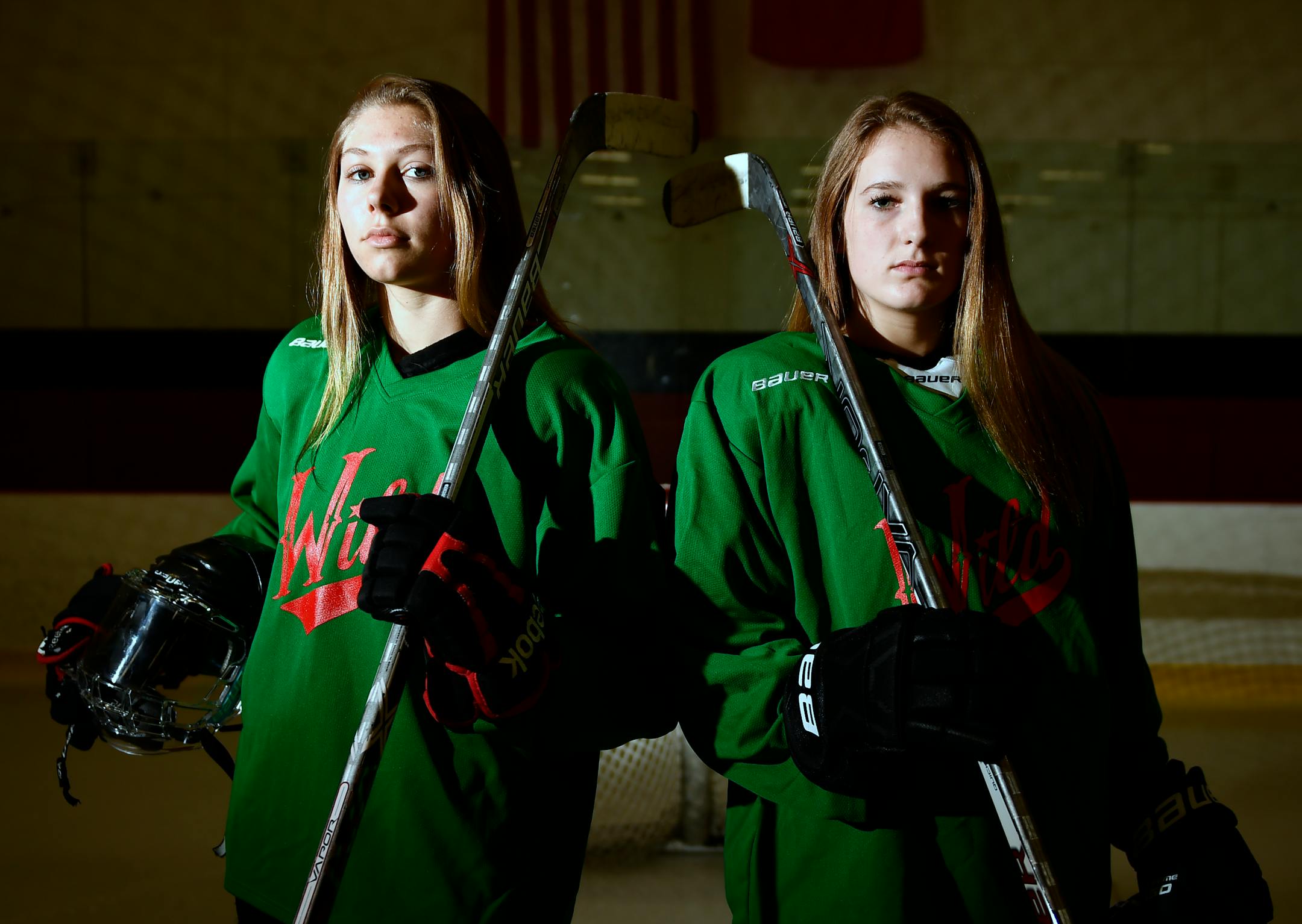 Centennial girls' hockey players Gabbie Hughes, right, and Anneke Linser.