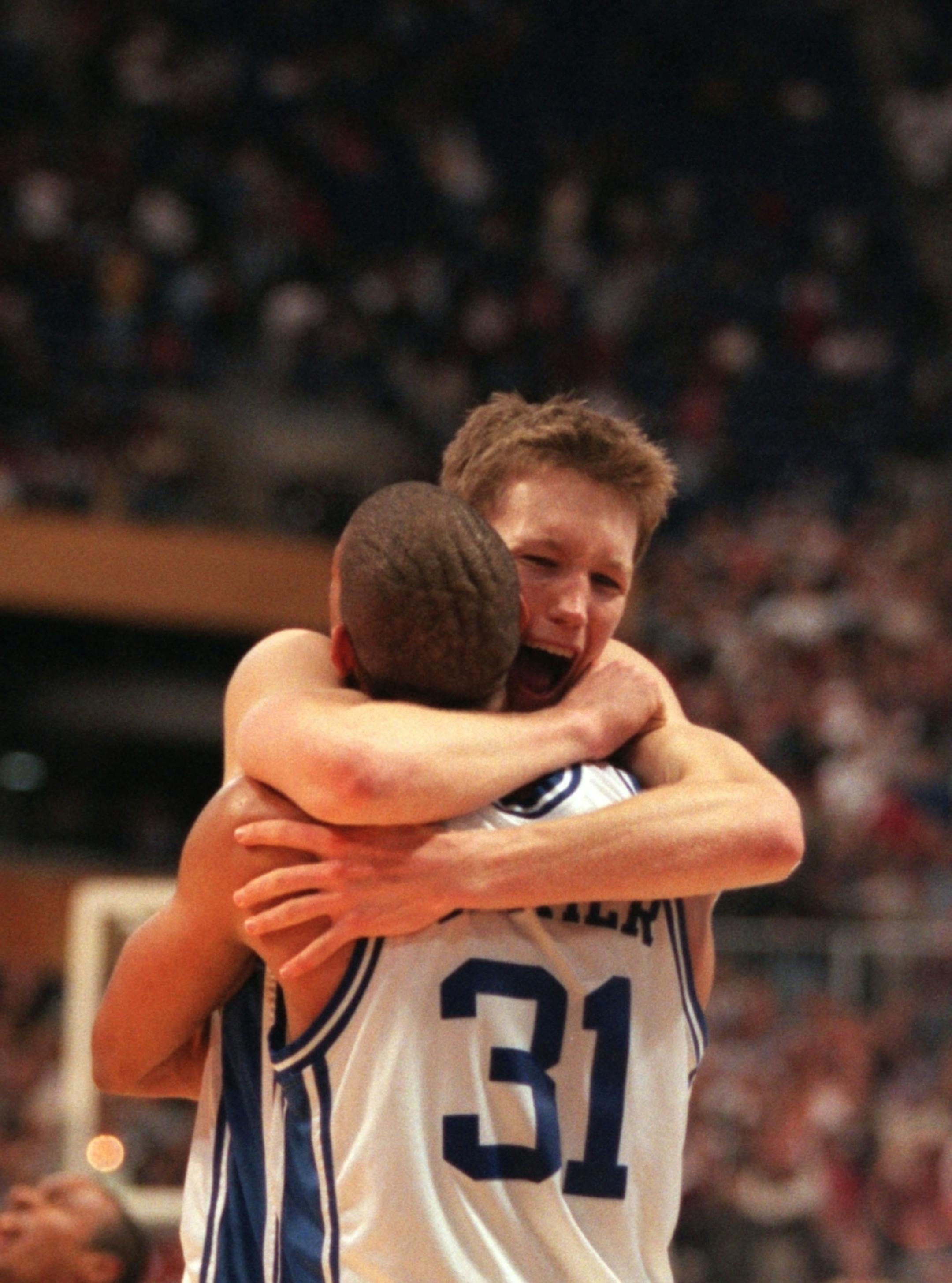 Duke's Mike Dunleavy and Shane Battier hug at the conclusion of their win over Arizona in the 2001 Final Four. (Carlos Gonzalez/Star Tribune)