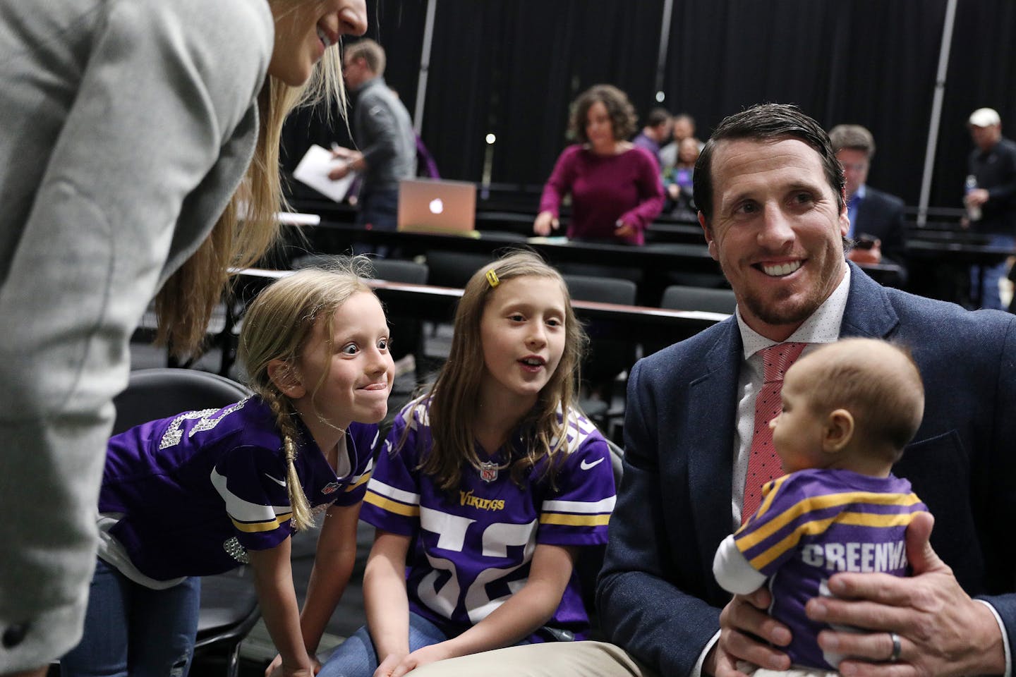 Vikings linebacker Chad Greenway holds his youngest daughter, Carsyn (three months) as other daughters, Maddy, left, 9, and Beckett, 6, made faces at her following the news conference on March 7, 2017, at Winter Park. Greenway officially announced his retirement from the NFL.