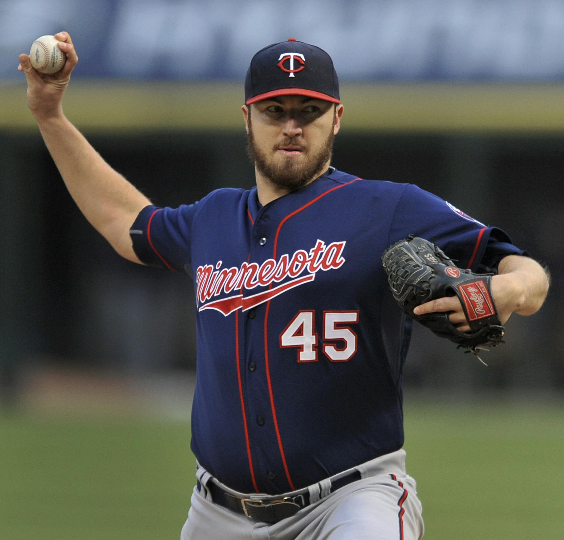 Minnesota Twins starter Phil Hughes delivers a pitch during the first inning of a baseball game against the Chicago White Sox in Chicago, Friday, May 22, 2015. (AP Photo/ Paul Beaty)