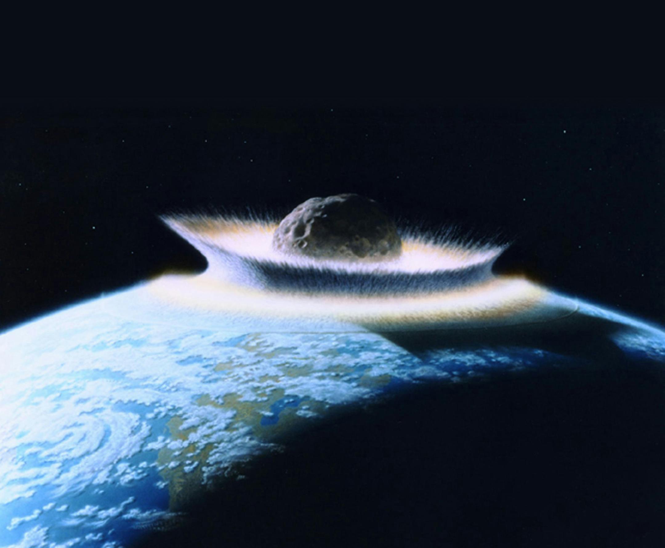 The illustration depicts an asteroid or comet hitting the earth during and event that scientists now believe triggered the death of most species 250 million years ago.