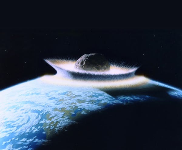 The illustration depicts an asteroid or comet hitting the earth during and event that scientists now believe triggered the death of most species 250 m