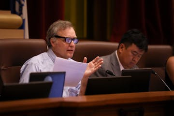 Council member Cam Gordon asking a question of the City of Minneapolis' Director of Internal Audit, Will Tetsell, during the committee meeting Wednesd