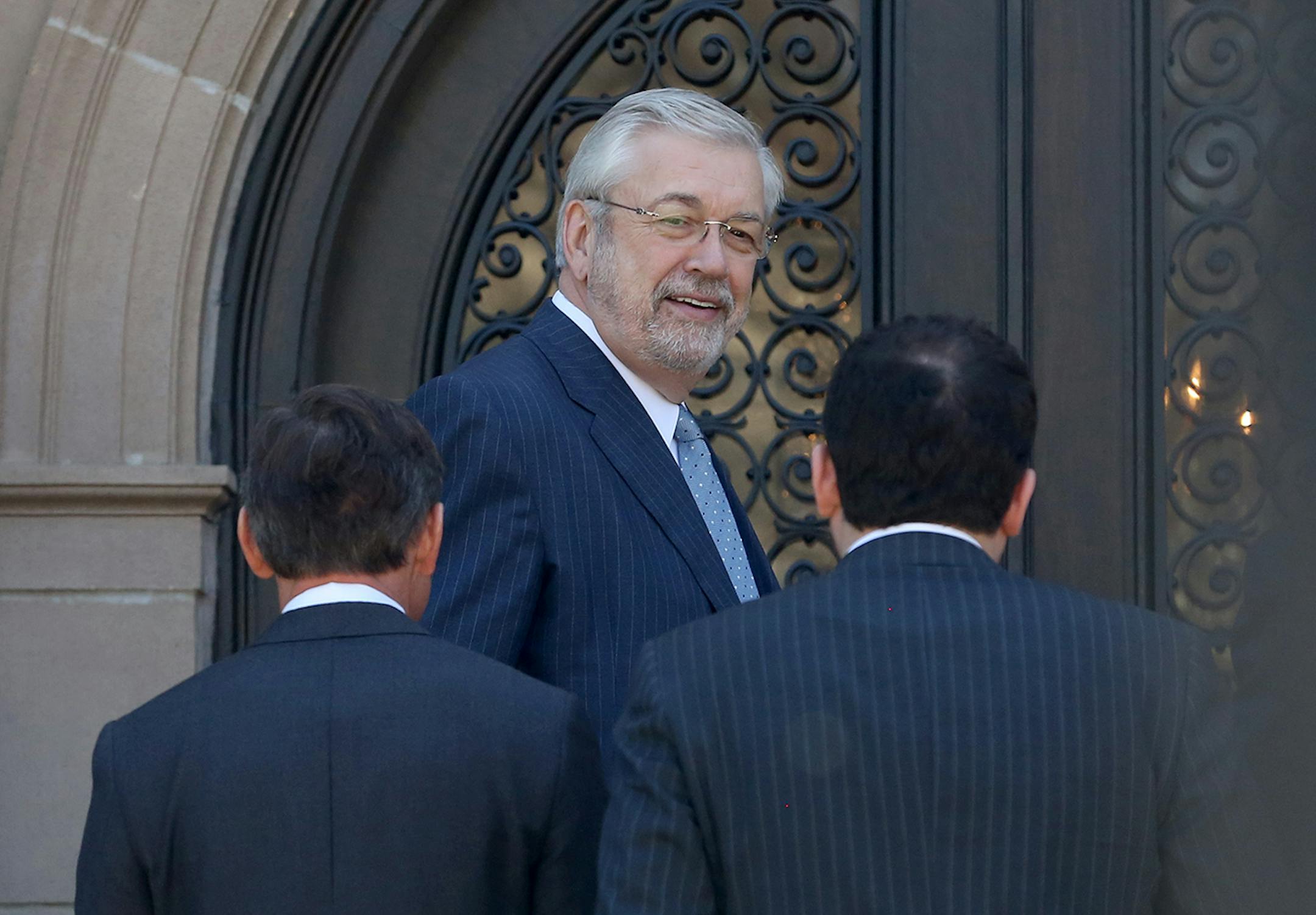 Dr. Bill McGuire, owner of Minnesota United FC, arrives at the governor's mansion, Tuesday, April 14, 2015, in St. Paul, Minn., for a meeting with Gov. Mark Dayton about building a new soccer stadium for the MLS franchise.