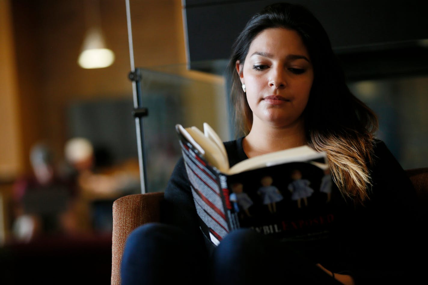 Amelia Delao-Peterson of St. Cloud read a book in the student center on UMD campus. University of Minnesota Duluth chancellor, Lendley Black hosted a "Town Hall" meeting for faculty, staff and students to give and update on the progress toward digging the Duluth campus out of of a multi-million dollar budget hole Thursday May 15, 2014 in Duluth , MN. ] Jerry Holt Jerry.holt@startribune.com