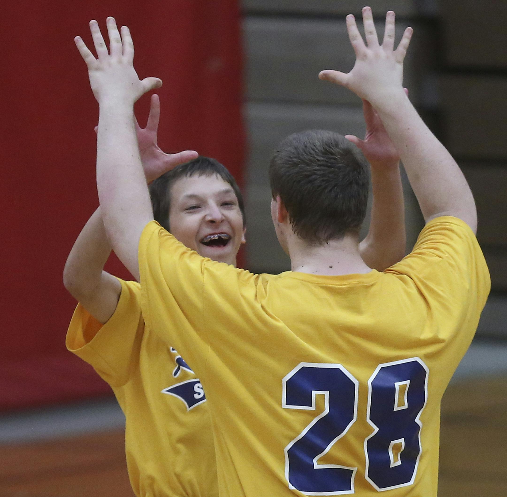 The Robins Joe Dubisar and Charlie Wittmer celebrated after winning the state championship for physically impaired adapted softball in Coon Rapids Min., Saturday, June 1, 2013. The Robins won 10-5 over Dakota United for the championship. ] (KYNDELL HARKNESS/STAR TRIBUNE) kyndell.harkness@startribune.com