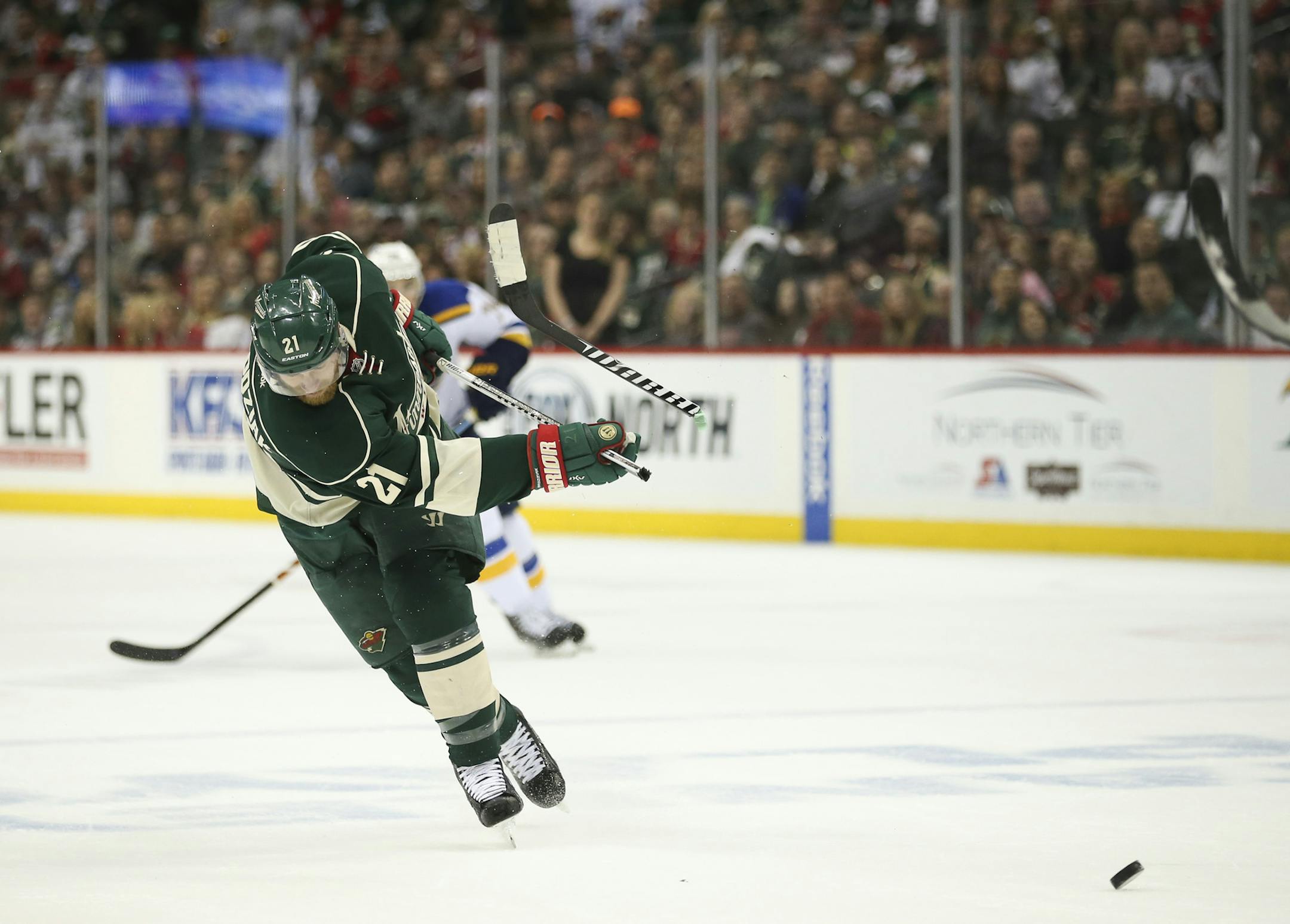 Minnesota Wild center Kyle Brodziak (21) broke his stick taking a first period shot Sunday afternoon. ] JEFF WHEELER ï jeff.wheeler@startribune.com The Minnesota Wild faced the St. Louis Blues in game 6 of their NHL playoff series Sunday afternoon, April 26, 2015 at Xcel Energy Center in St. Paul.