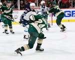 The Minnesota Wild's Matt Dumba ties the score at 2-2 on a slap shot during the second period of the home opener at the Xcel Energy Center Saturday, O