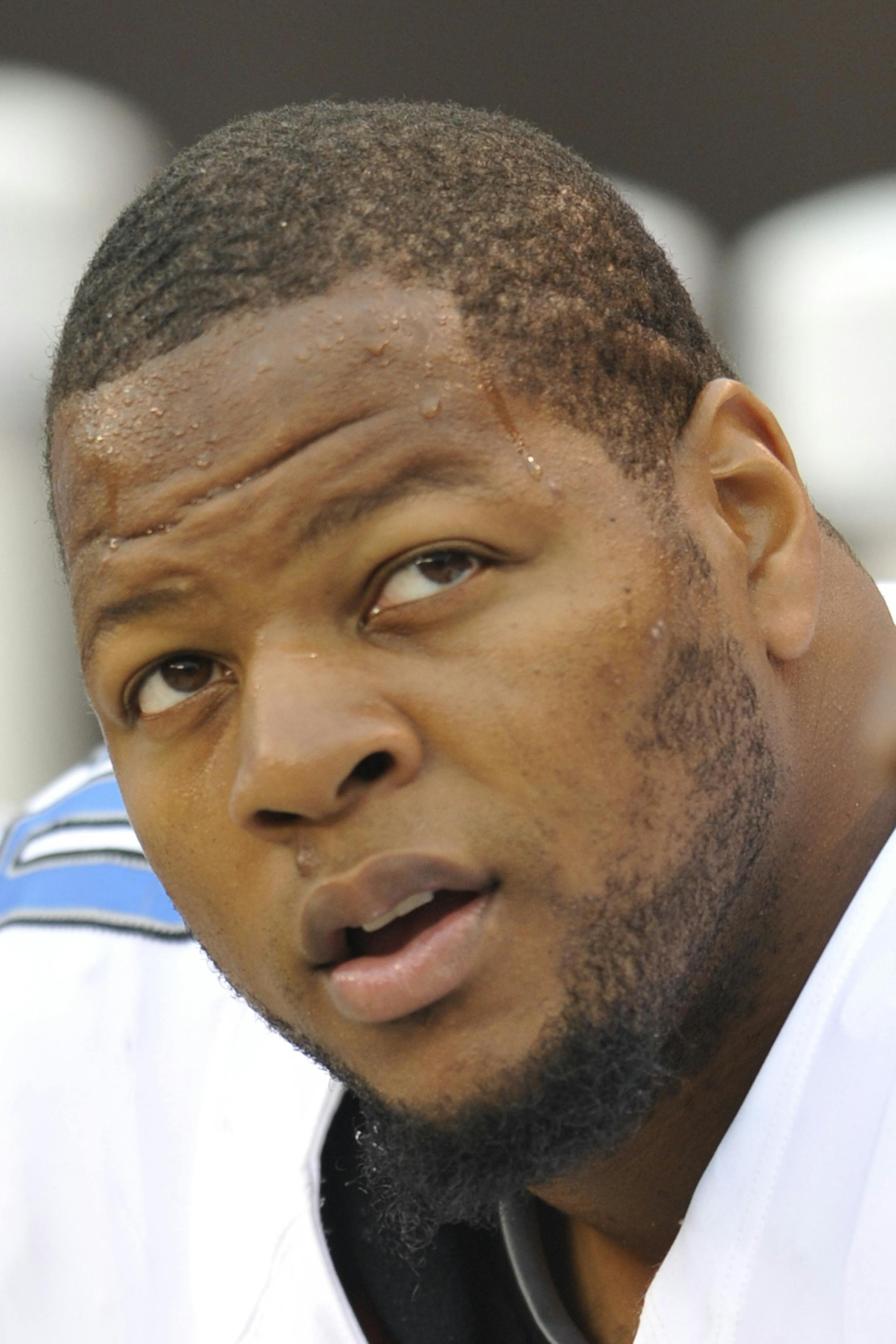 Detroit Lions defensive tackle Ndamukong Suh (90) sits on the sideline during an NFL football game against the Cleveland Browns Sunday, Oct. 13, 2013 in Cleveland. Detroit won 31-17. (AP Photo/David Richard)