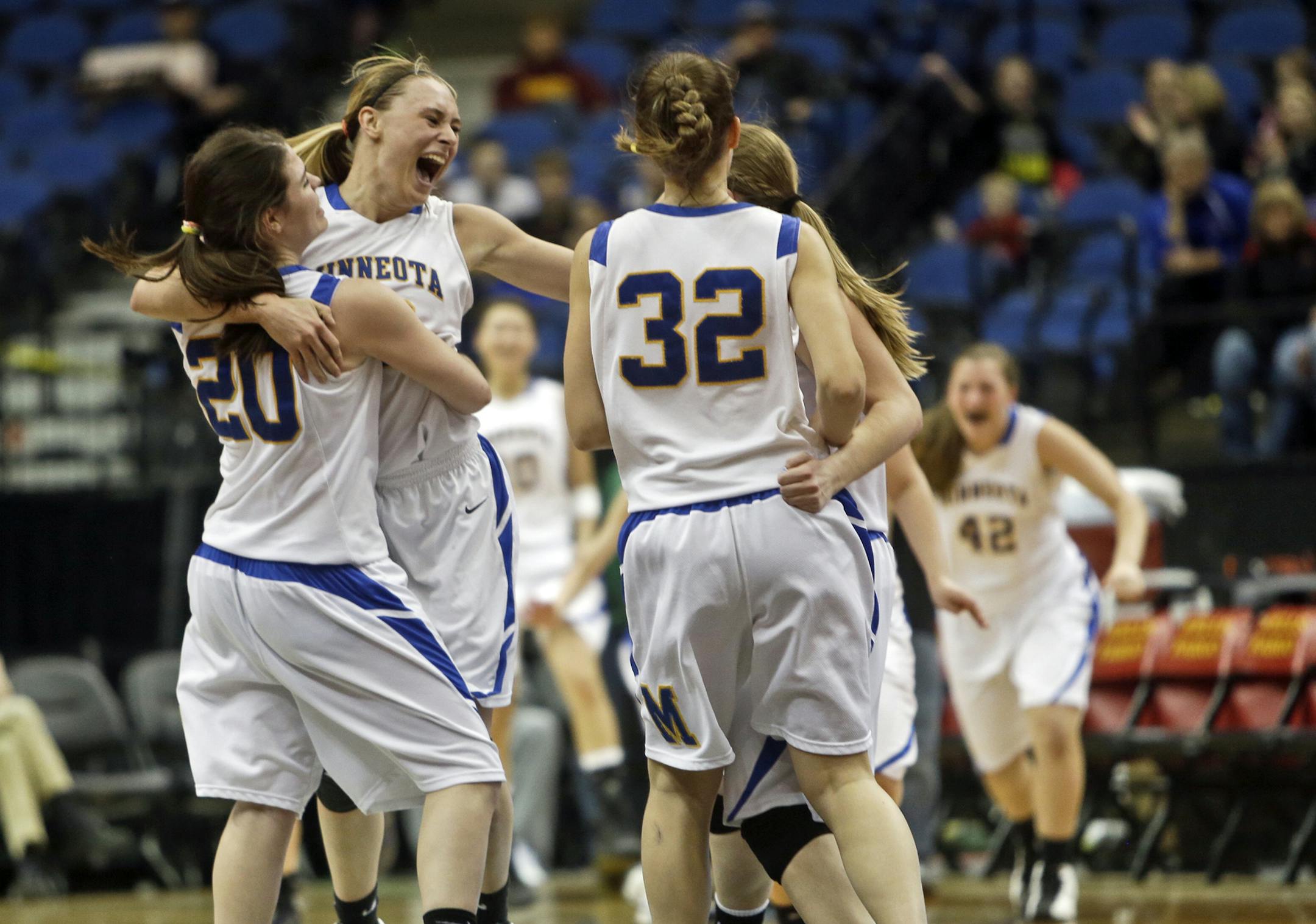 Minneota's Taylor Reiss, second from left, and Emily Stienessen (20) celebrate at the end of regulation with temmates their 61-51 win over Ada-Borup in the girls basketball state tournament (class 1A) finals Saturday, March 16, 2013, at the Target Center in Minneapolis. Reiss led all scorers with 30 points.](DAVID JOLES/STARTRIBUNE) djoles@startribune.com girls basketball state tournament (class 1A) finals Saturday, March 16, 2013, at the Target Center in Minneapolis.**Taylor Reiss, Emily Stiene
