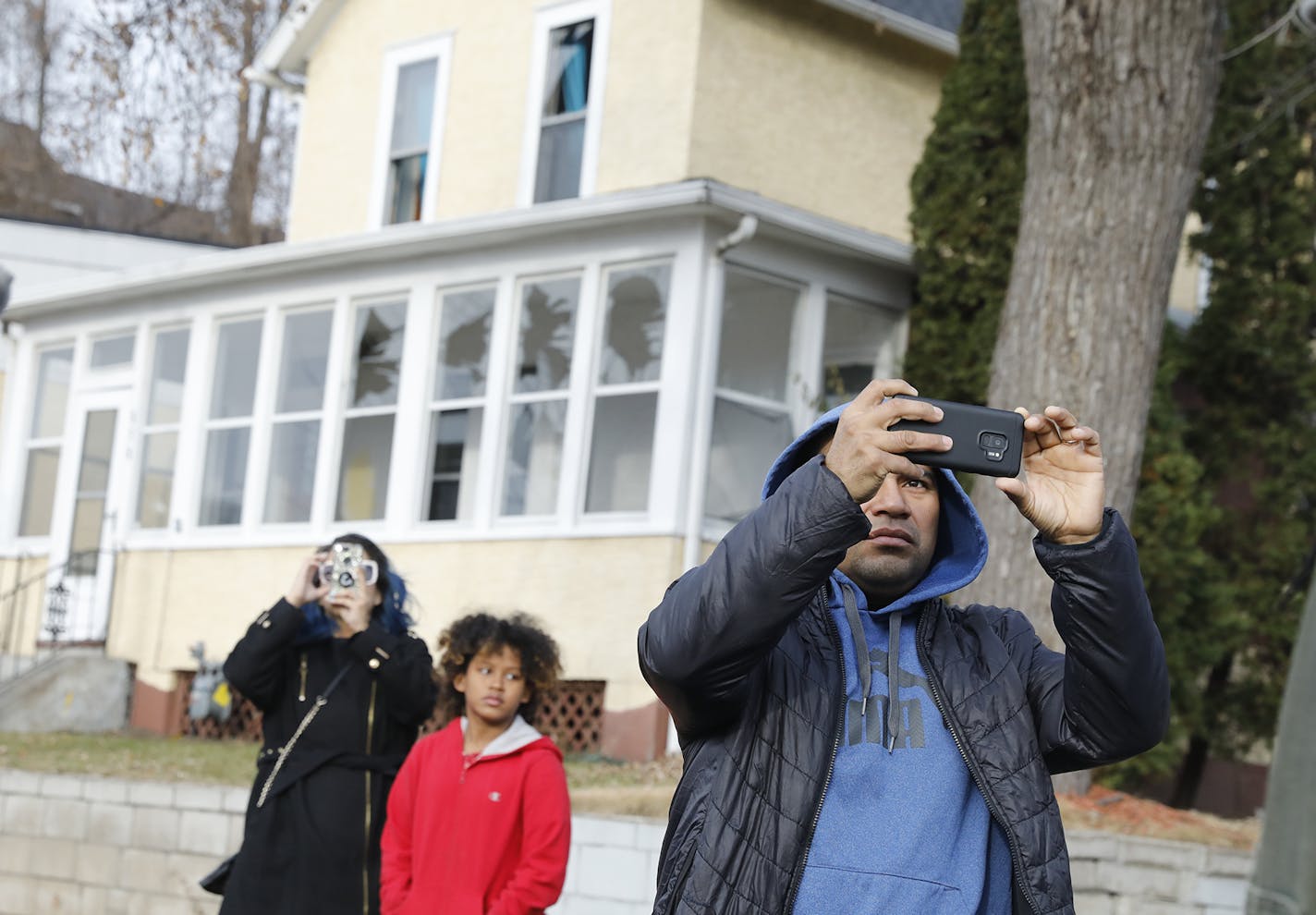 Pedestrians gathered at the scene of a house explosion in St. Paul. ] LEILA NAVIDI &#x2022; leila.navidi@startribune.com BACKGROUND INFORMATION: St. Paul firefighters at the scene of an explosion at the 600 block of Payne Avenue in St. Paul on Friday, November 23, 2018. One man was taken to a local hospital with injuries and his status is unknown. Eight people were displaced by the explosion.