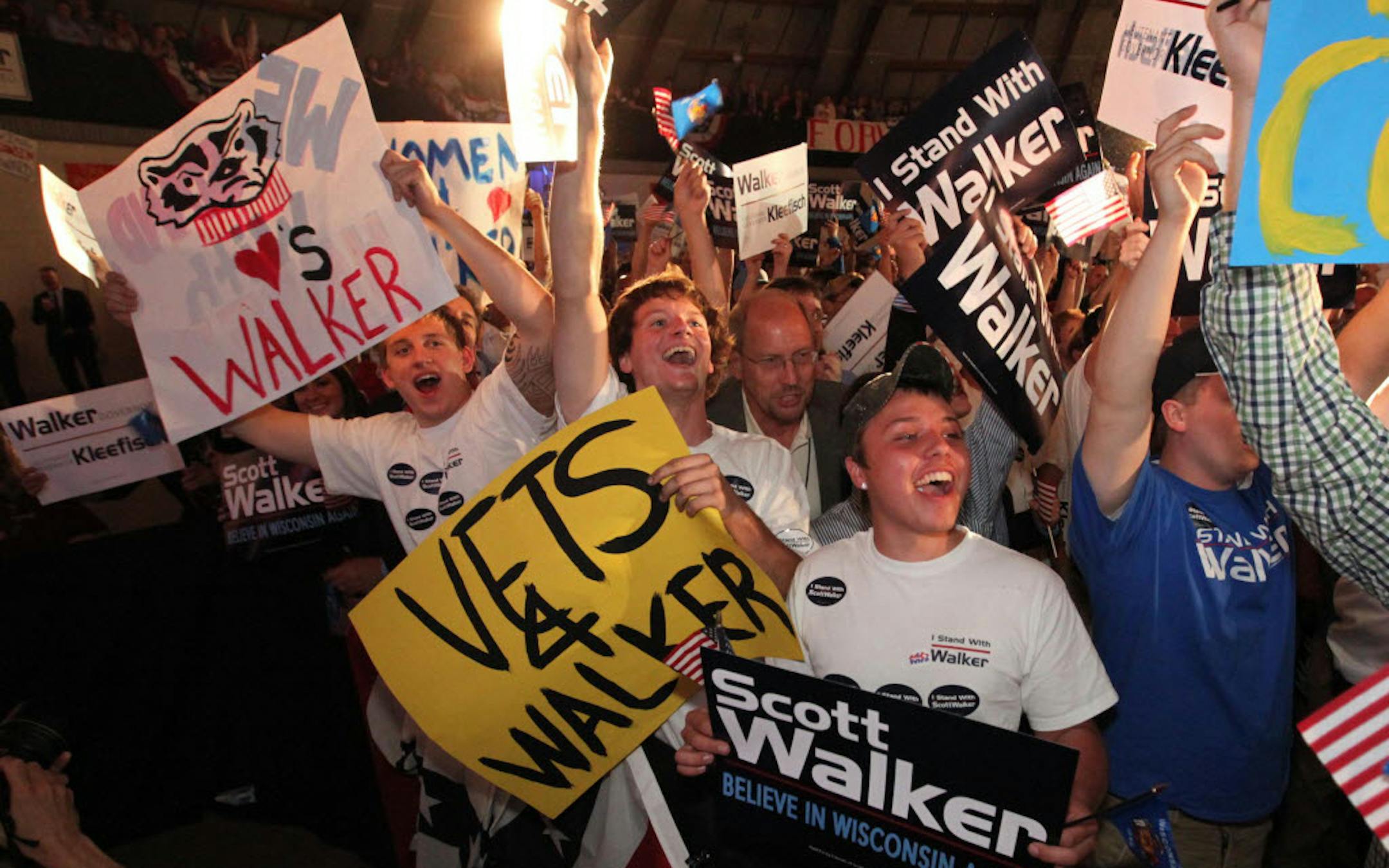 Fans cheer as results come in early showing a lead for Wisconsin Gov. Scott Walker at the Waukesha Expo Center.