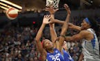 Lynx Sylvia Fowles passed the ball pass Wings Glory Jonson (25) and Liz Cambage at Target Center Tuesday , June 19, 2018 in Minneapolis, MN.