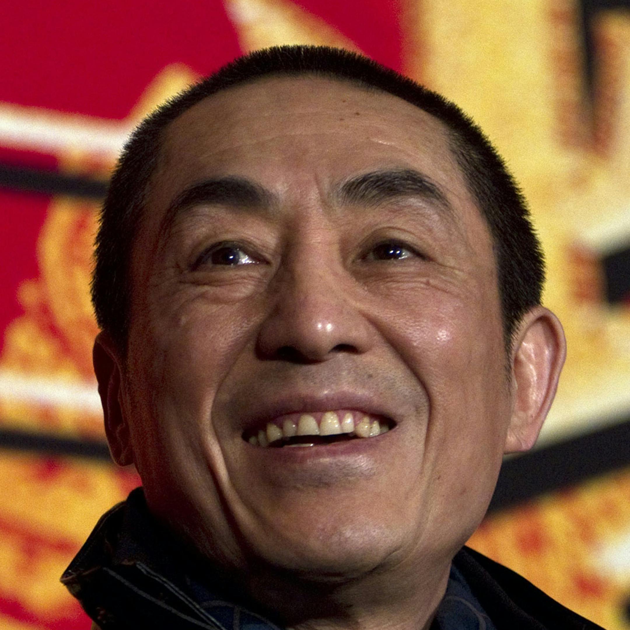 FILE - In this Dec. 22, 2010 file photo, Chinese director Zhang Yimou smiles during a press conference to promote his new movie in Beijing. Media reports circulated online this week that Zhang Yimou, who is also known as the architect of the opening ceremony for the Beijing Olympics, has seven children from his two marriages and from relationships with two other women. (AP Photo/Alexander F. Yuan, File)